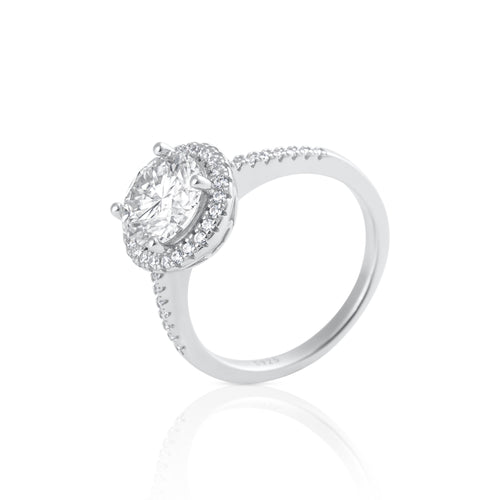 Side view of round halo moissanite ring with pavé band in platinum plated sterling silver