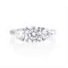 Trilogy ring with 2.2 ct brilliant cut moissanite in platinum plated 925 sterling silver front view