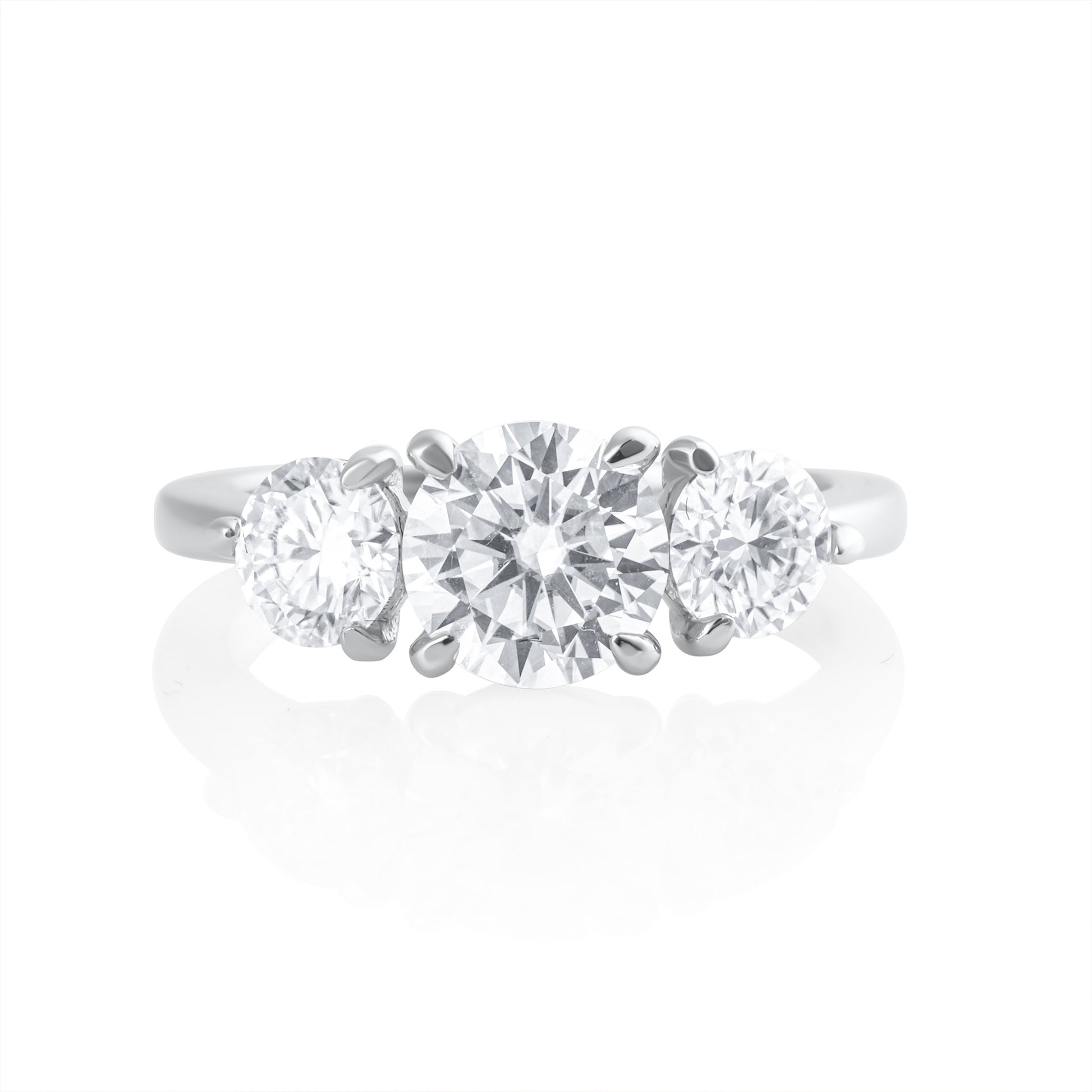 Trilogy ring with 2.2 ct brilliant cut moissanite in platinum plated 925 sterling silver front view