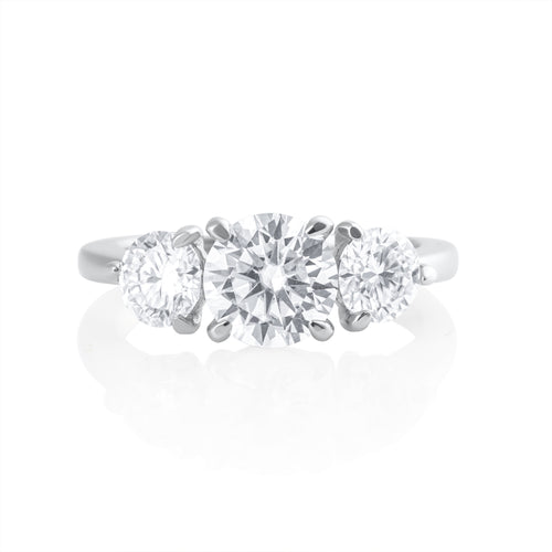 Trilogy ring with 2.2 ct brilliant cut moissanite in platinum plated 925 sterling silver front view