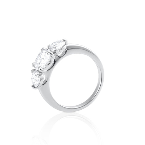 Side view of trilogy moissanite ring with three brilliant cut stones in sterling silver