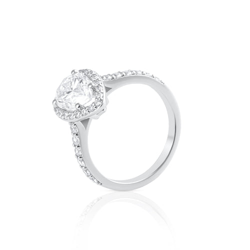Side view of pear cut moissanite halo ring in platinum plated sterling silver