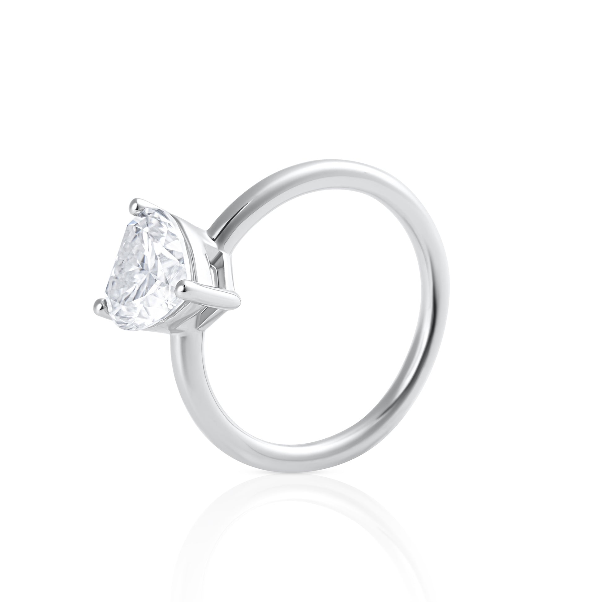 Side view of Cuore heart shaped emerald cut moissanite ring in platinum plated sterling silver