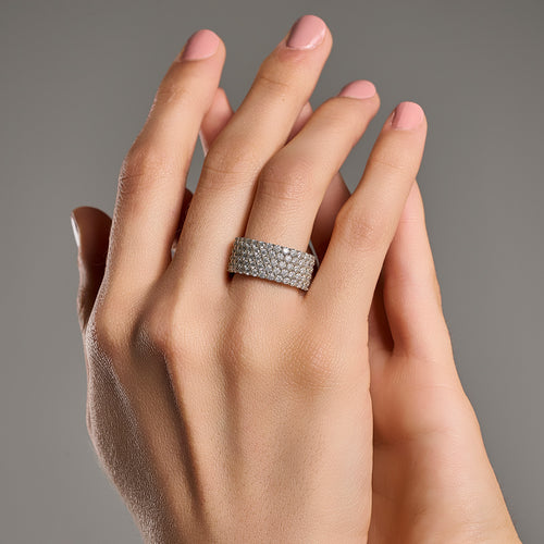 Grand eternity moissanite ring worn on hand in 925 sterling silver