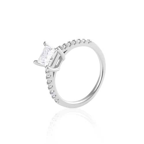 Princess cut moissanite ring with pavé side stones in platinum plated sterling silver side view