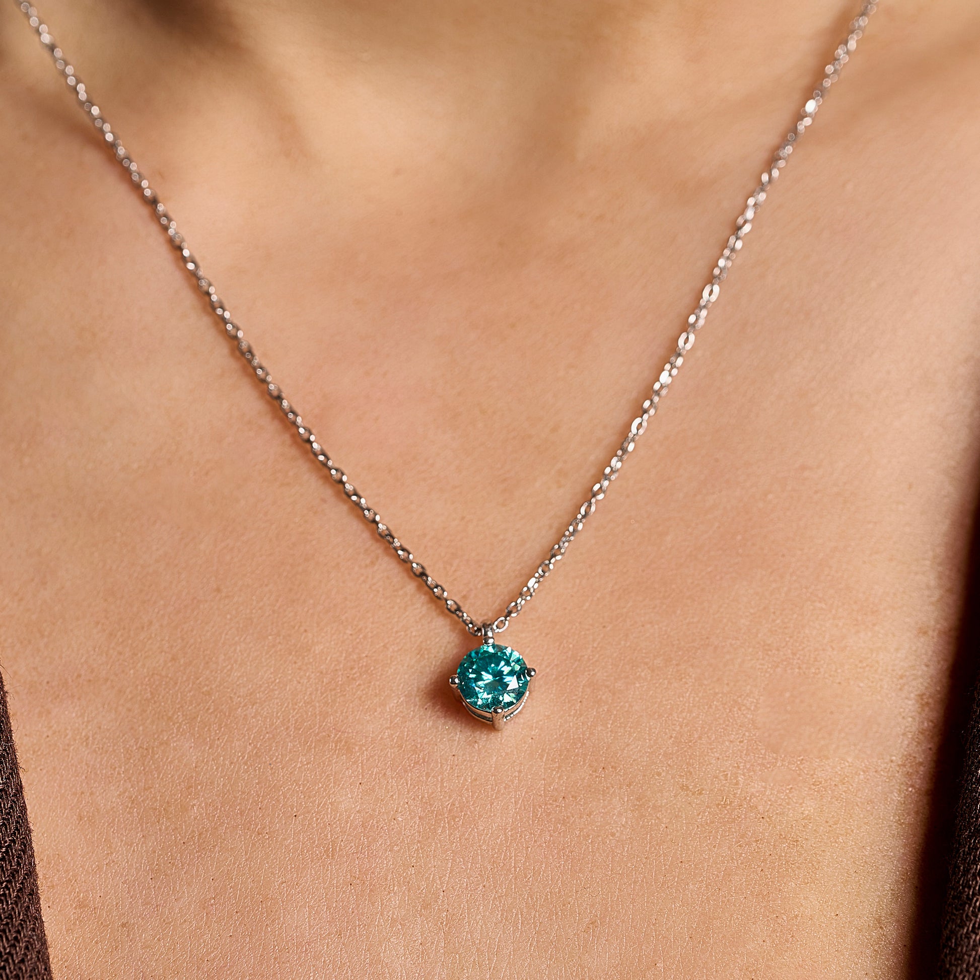 Summer Edition aquamarine light point necklace in 925 sterling silver with 1 ct moissanite worn on neck