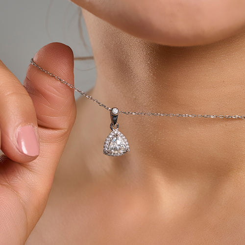 Trillion cut halo necklace in 925 sterling silver with 1 ct moissanite held near the neck