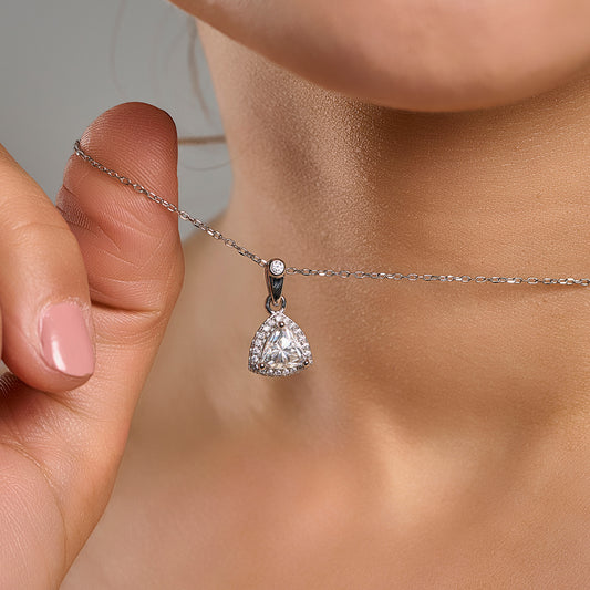 Trillion cut halo necklace in 925 sterling silver with 1 ct moissanite held near the neck