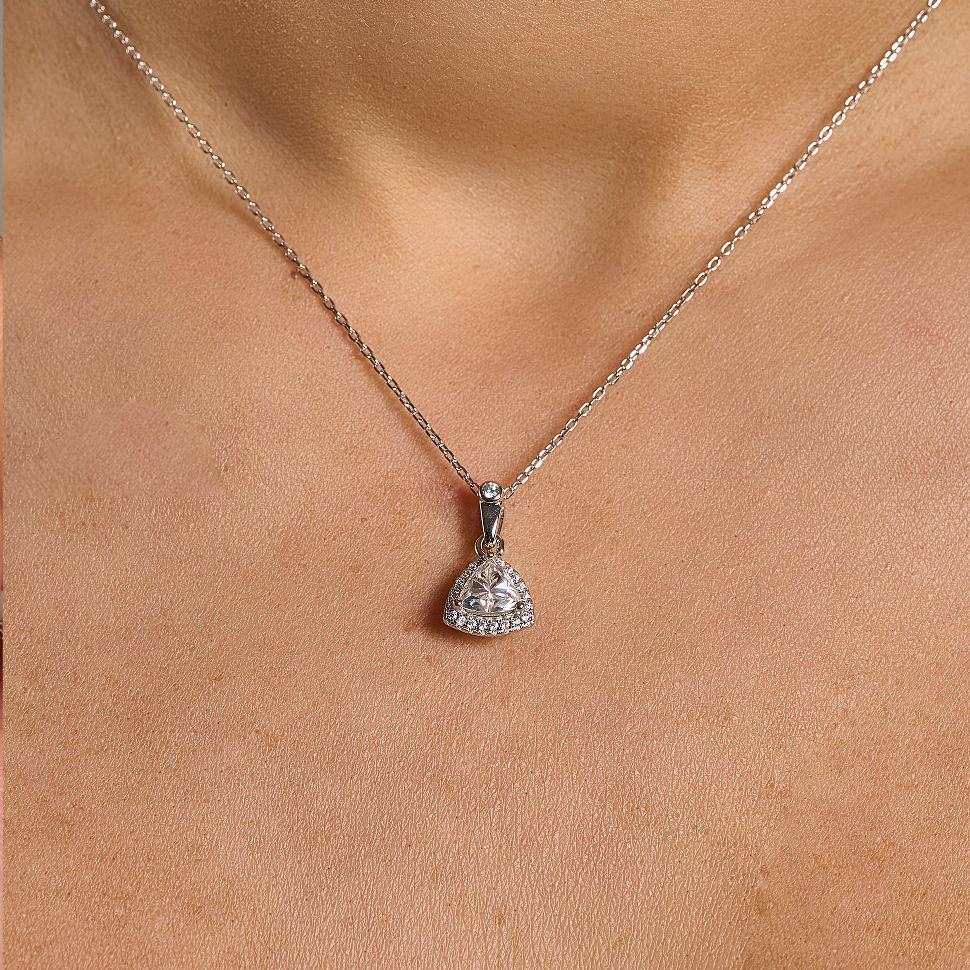 Trillion cut halo necklace in 925 sterling silver with 1 ct moissanite worn on neck