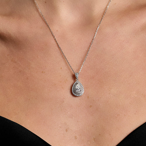 Goccia Contorno -teardrop halo- necklace in 925 sterling silver with 1 ct moissanite worn on neck