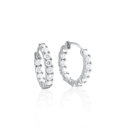 Pair of hoop earrings with brilliant cut moissanite stones in 925 sterling silver displayed on a white background with reflective surface.